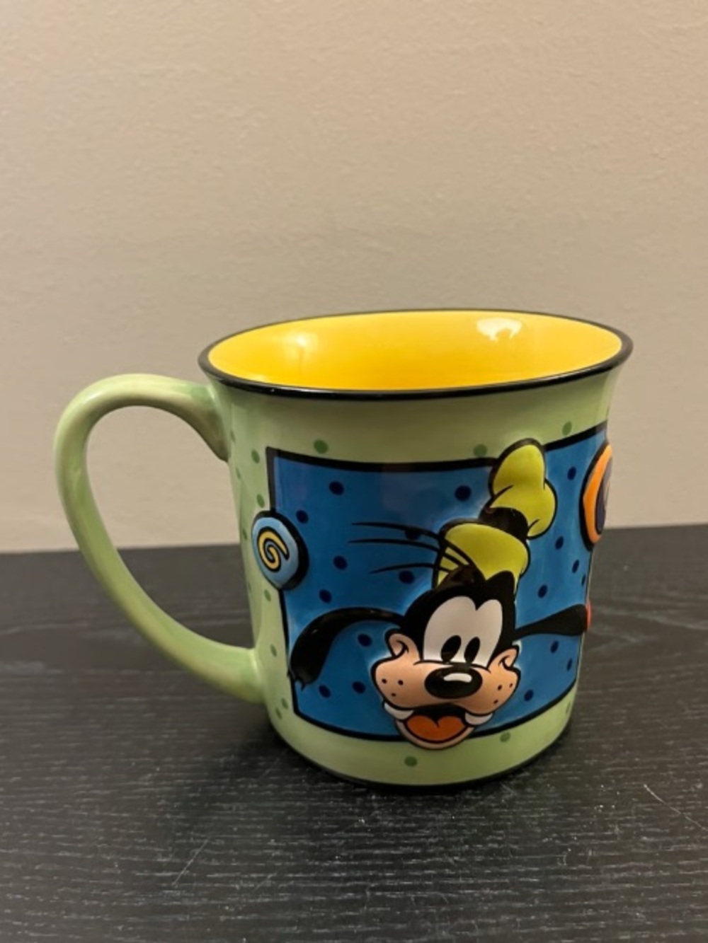 Playful Ceramic Mug with Yellow Interior and Light Green Exterior